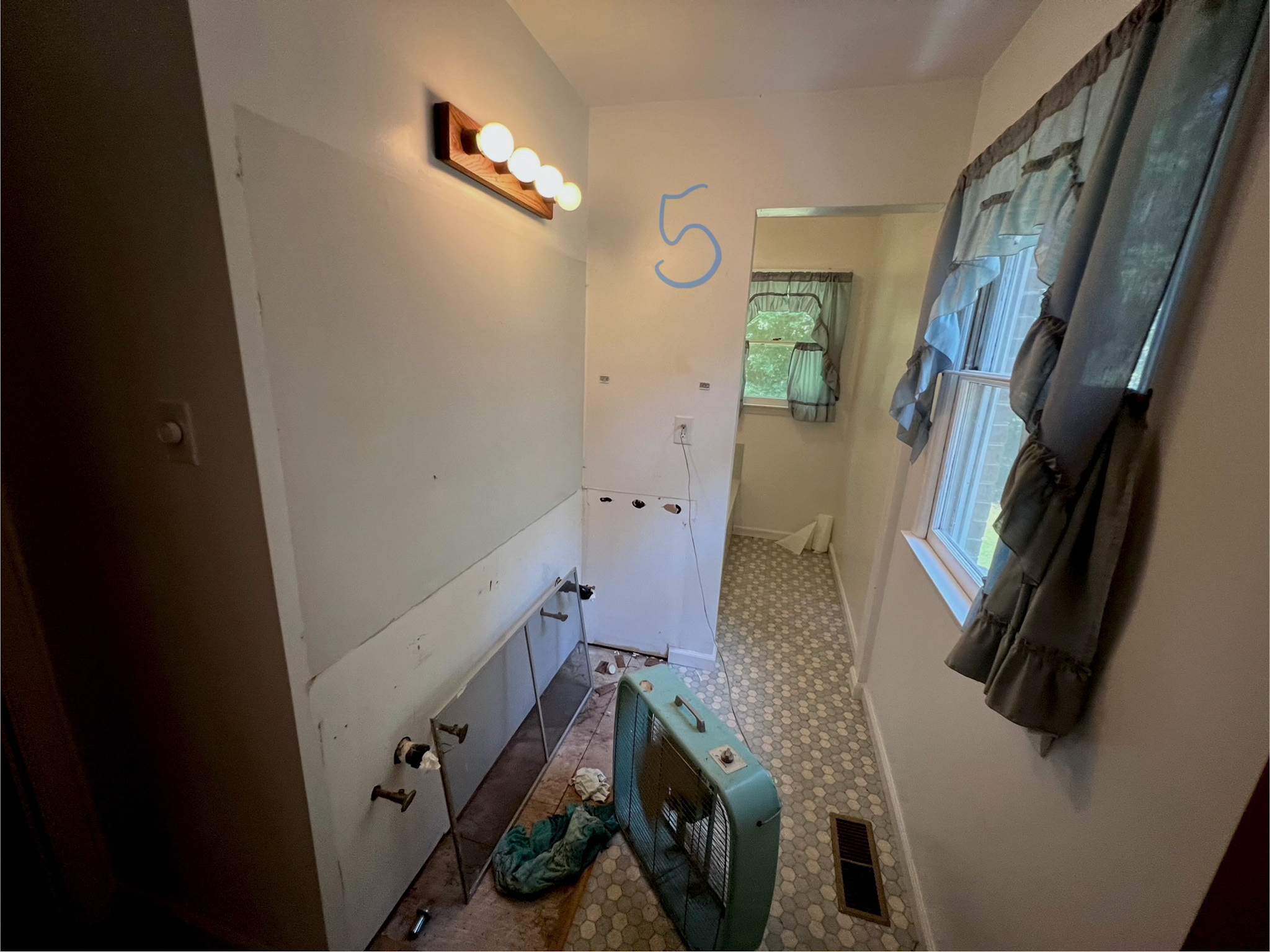 Before: dated bathroom fixtures and colors